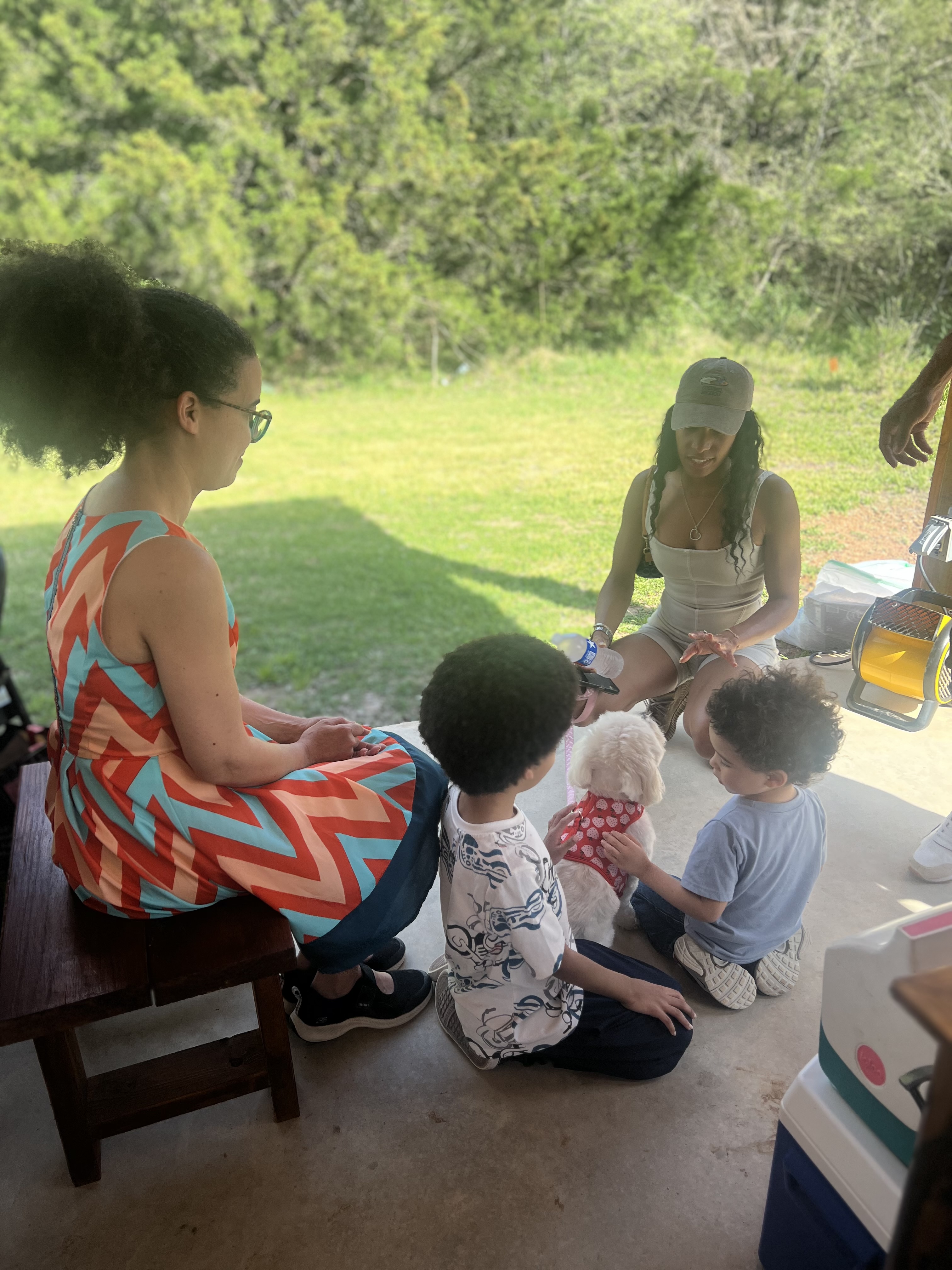 Family with a puppy at an outdoor gathering